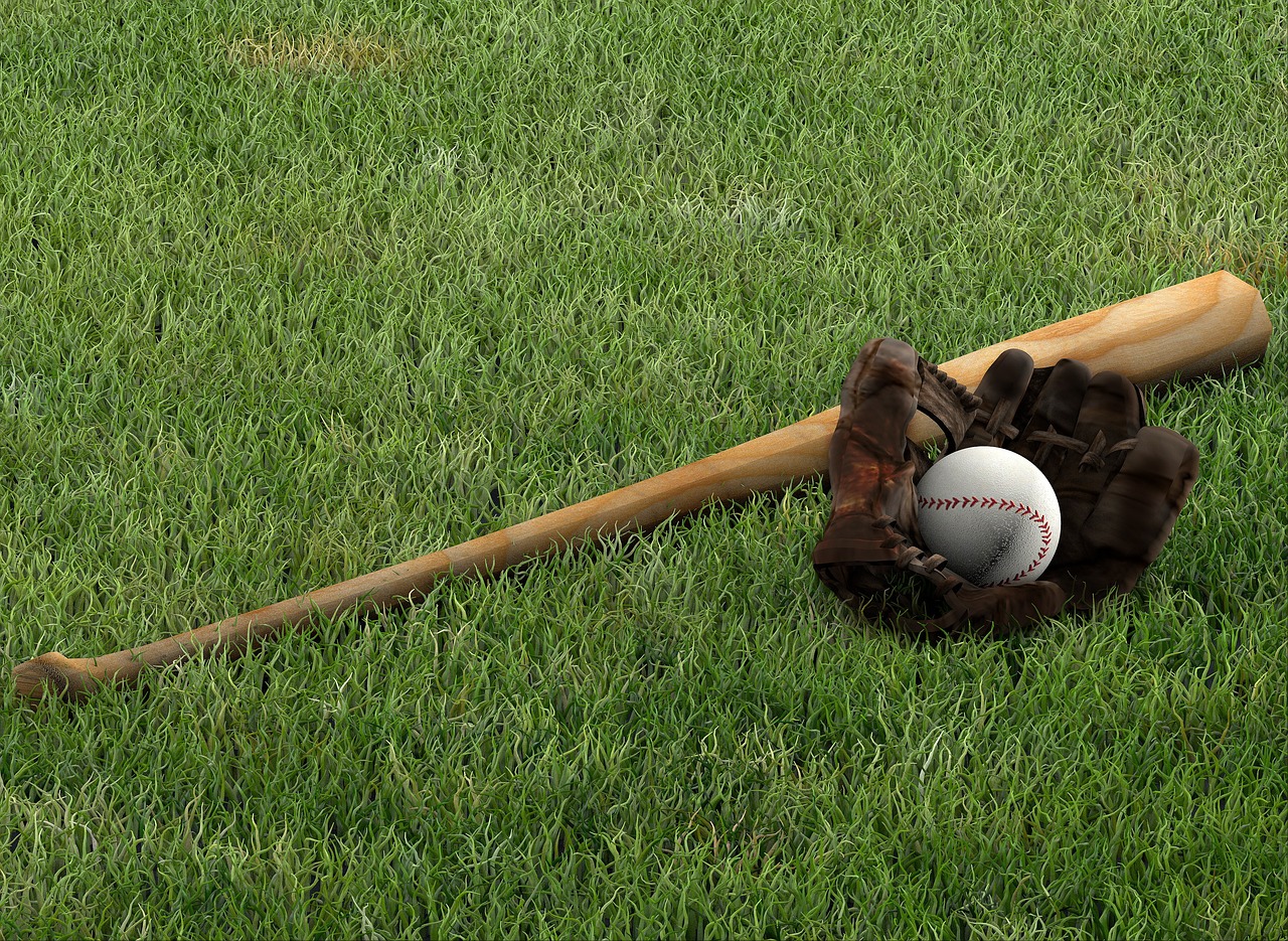 Baseball glove and bat on the lawn