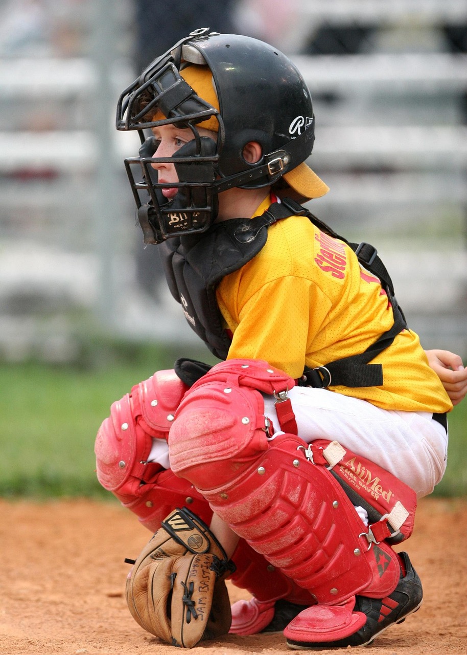 Youth baseball catcher in action during a game