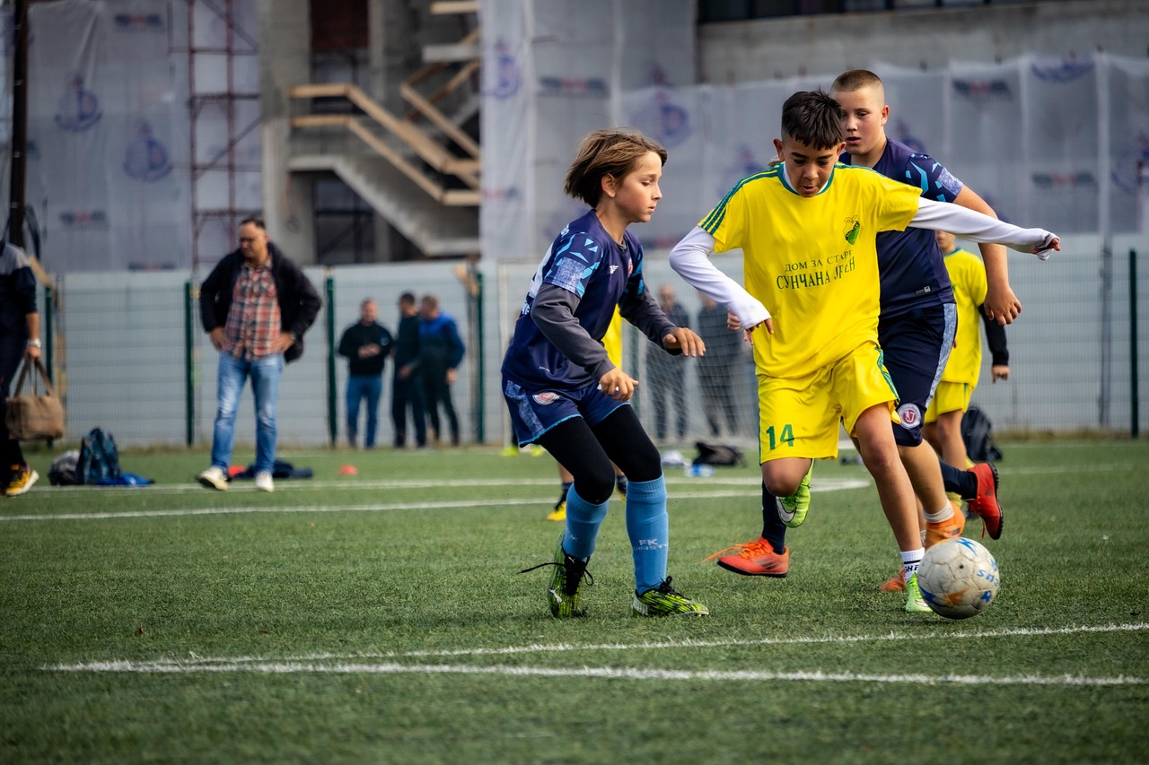 Kids playing a youth soccer game