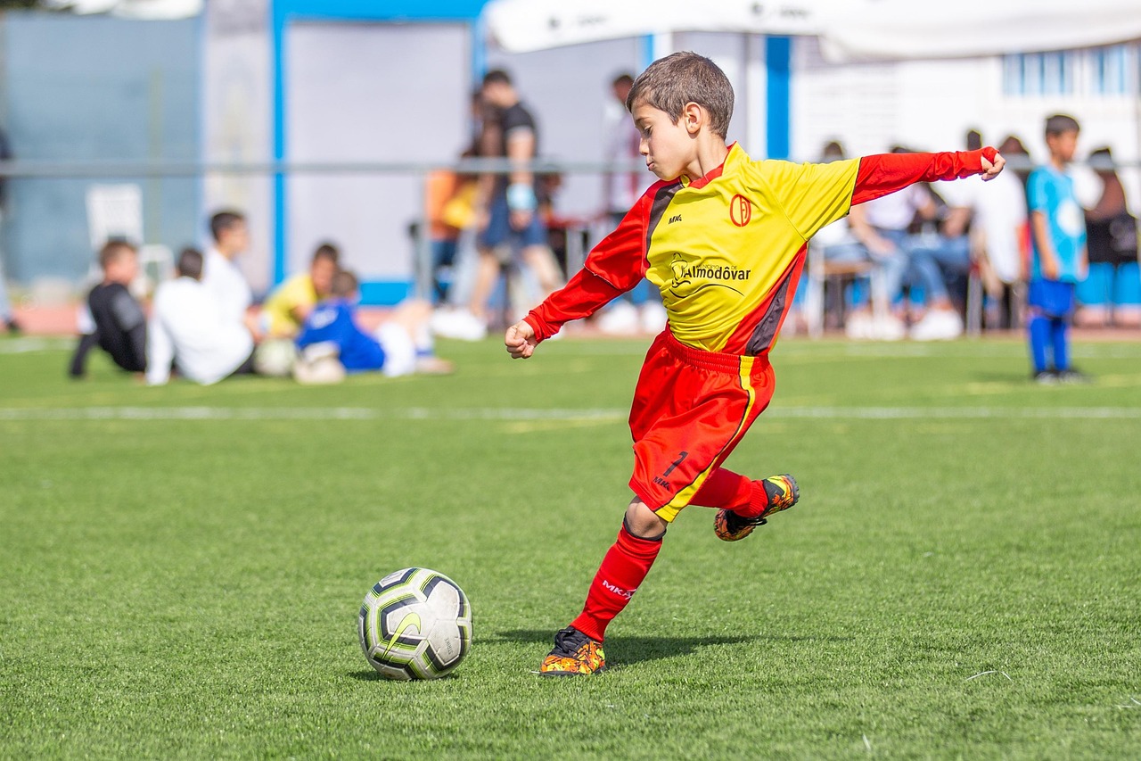 Child playing youth sports outdoors
